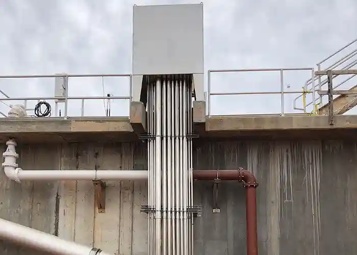 Conduiting running up side of basin